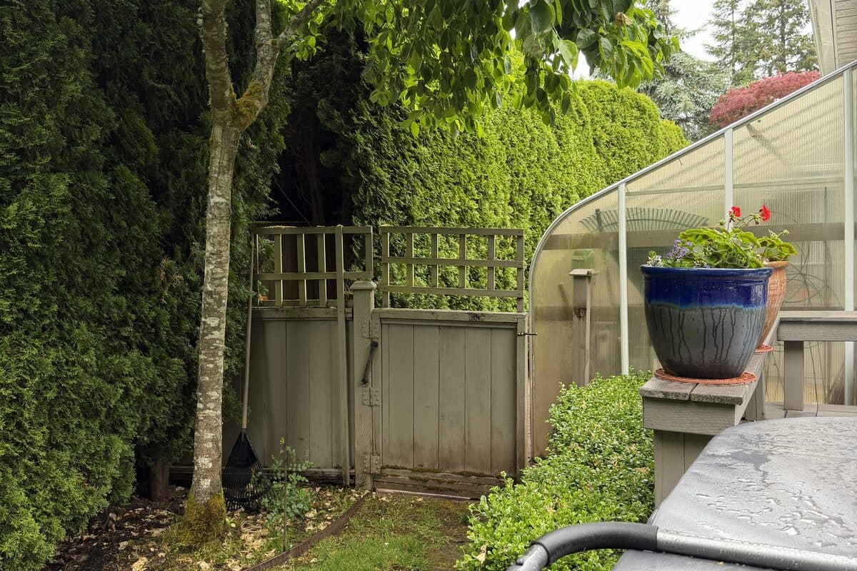 Backyard fence area before Proline installation in Parksville